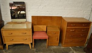 E Gomme early G-Plan oak bedroom suite comprising chest of drawers, dressing table/chest of drawers,