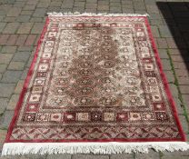 Red ground rug 168 cm x 122 cm