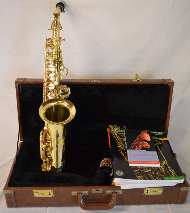 Trevor J James & Co. The Horn saxophone in a case with tutor books