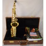 Trevor J James & Co. The Horn saxophone in a case with tutor books