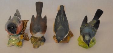 4 Beswick birds: White throat, Nutcracker, Bullfinch & one other (repaired)