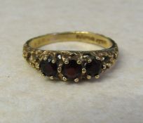 9ct gold garnet trilogy ring size Q/R weight 2.9 g