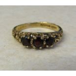 9ct gold garnet trilogy ring size Q/R weight 2.9 g