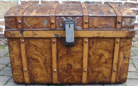 Large metal trunk with brass lock and wood grained decoration