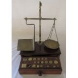 Set of Victorian brass scales on a mahogany base with drawer containing assorted weights L 35 cm H