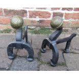 Pair of cast iron and brass fire dogs
