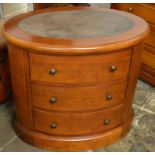 Oval mahogany chest of drawers with leather skiver top Dia. 83cm Ht 75cm