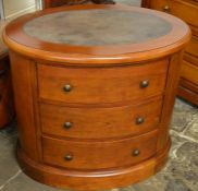 Oval mahogany chest of drawers with leather skiver top Dia. 83cm Ht 75cm