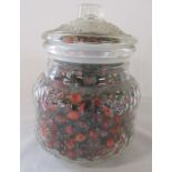 Glass jar containing red/orange marbles H 22 cm D 16 cm