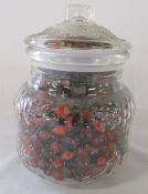 Glass jar containing red/orange marbles H 22 cm D 16 cm