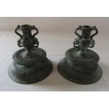Pair of cast metal Middle Eastern candlesticks