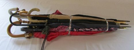 Assorted vintage umbrellas one with silver collar