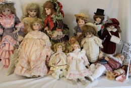 Quantity of modern bisque head dolls including Ashton Drake & some doll stands
