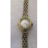 Ladies 18ct gold Emka wrist watch 17 jewels with 9ct gold strap total weight 14.3 g (back of watch
