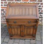 Oak bureau with linen fold panels