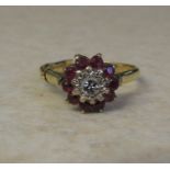 18ct gold ruby and diamond cluster ring (central diamond 0.10 ct) size P weight 4.3 g