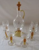Glass decanter with yellow glass trim and stopper decorated with grapes and vines together with 6
