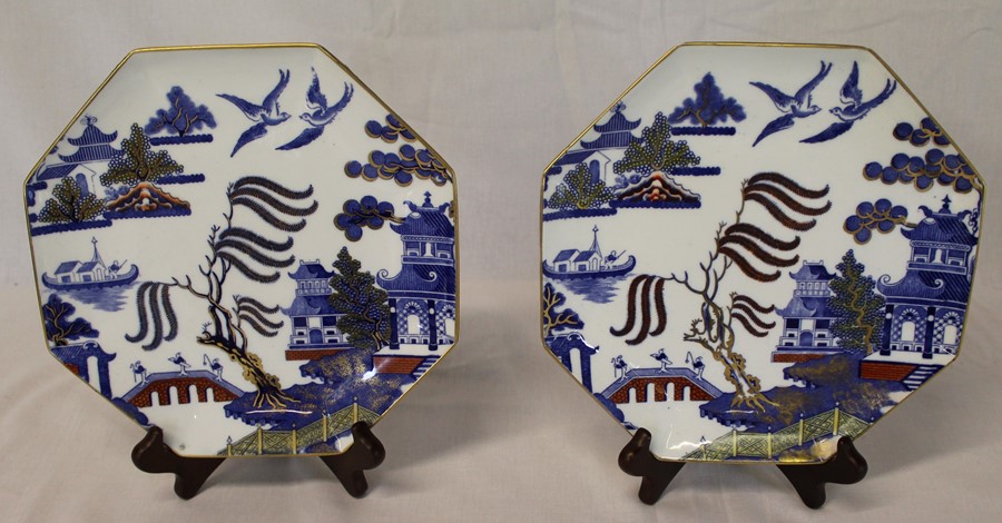 Pair of Wedgwood octagonal Willow pattern plates with gilt detail, impressed Portland mark, dia.