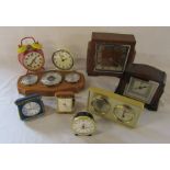 Various clocks and barometers