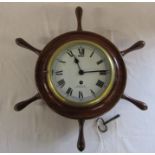 Brass bulkhead clock in ships wheel frame reputedly removed from HMS Ajax with key H 49 cm L 39 cm