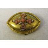 Tested as 14 ct gold memorial brooch decorated with coral and seed pearls, total weight 11.7 g, D 42