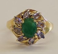 Tested as 14ct gold (marked 14k) emerald and iolite ring, size P 1/2, weight approximately 4.62g