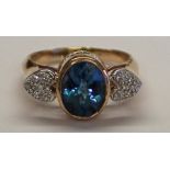 14K London blue topaz ring (3ct) set with heart shaped diamond chip shoulders, size R, weight