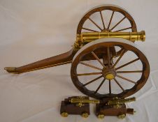 Brass & wood model cannon (Ht 26cm)  & a pair of miniature cannons