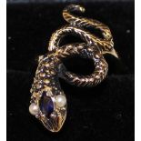 Tested as possibly 14ct snake ring set with pearl eyes and sapphire, size R, weight approximately