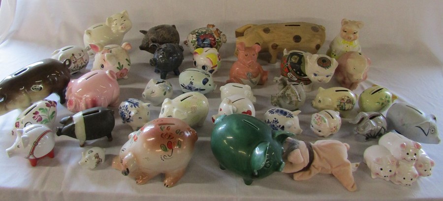 2 boxes of assorted ceramic and pottery pigs etc