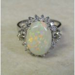 14ct white gold diamond and opal cluster ring (marked 14K), diamond total  0.64 ct, size N, (opal 13