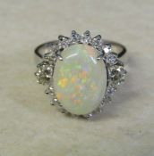 14ct white gold diamond and opal cluster ring (marked 14K), diamond total  0.64 ct, size N, (opal 13