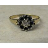 9ct gold diamond and sapphire cluster ring size N/O weight 2.1 g