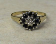 9ct gold diamond and sapphire cluster ring size N/O weight 2.1 g