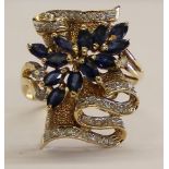 Tested as 14ct gold (marked 14k) sapphire and diamond ring, with 13 marquise cut sapphires 4 x 2.
