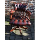 Ox blood colour button back leather swivel chair