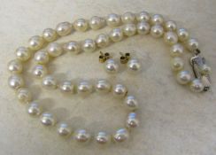 String of pearls with silver clasp and pair of 9ct gold pearl stud earrings. Approximate length