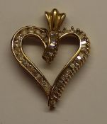 Heart shaped pendant marked 10k set with diamonds, weight approximately 4.2g