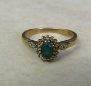 9ct gold ring with green gemstone and diamond chips size O/P weight 2.5 g