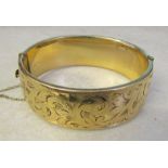 9ct gold bangle with metal core (1/5 9ct gold) total weight 52.8 g