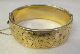 9ct gold bangle with metal core (1/5 9ct gold) total weight 52.8 g