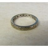 Tested as 18ct gold full diamond chip eternity ring, size M, (missing two stones), total weight 2.