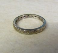 Tested as 18ct gold full diamond chip eternity ring, size M, (missing two stones), total weight 2.