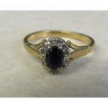 18ct gold diamond and sapphire cluster ring, size M, total weight 3.4 g