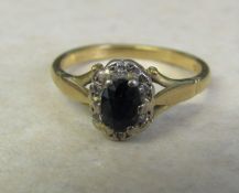 18ct gold diamond and sapphire cluster ring, size M, total weight 3.4 g