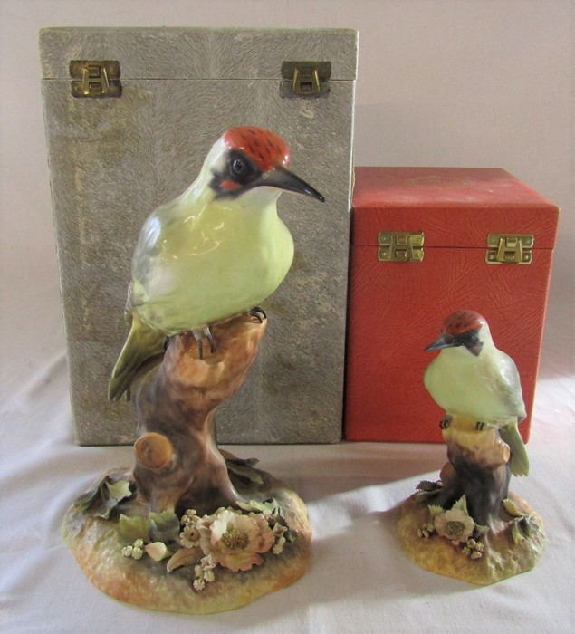 2 boxed Royal Crown Derby green woodpeckers H 24 cm signed M.E.T and H 15 cm signed M Dudley