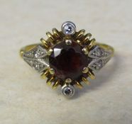 18ct gold diamond and red gemstone ring size M weight 4.2 g (red stone 6 mm x 6 mm)