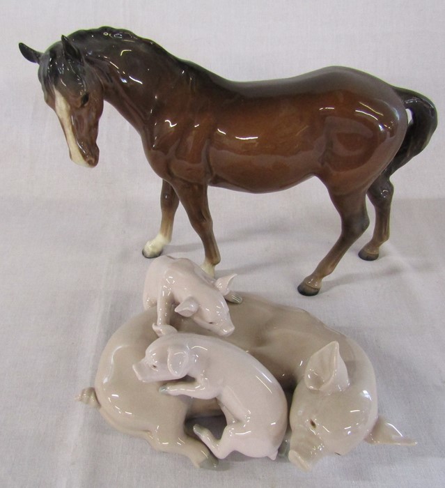 Beswick horse and a Lladro group of pigs