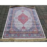 Ivory ground cashmere rug with floral medallion pattern approx 172cm by 116cm