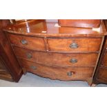 A mahogany bowfront chest of two short and two long drawers with oval handle plates, on bracket